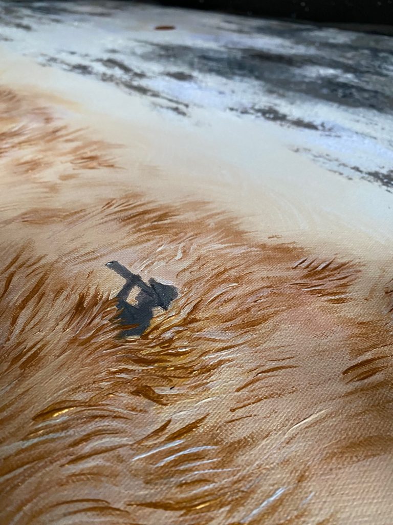 Detailaufnahme von der Savanne mit einer angedeuteten menschlichen Silhouette.